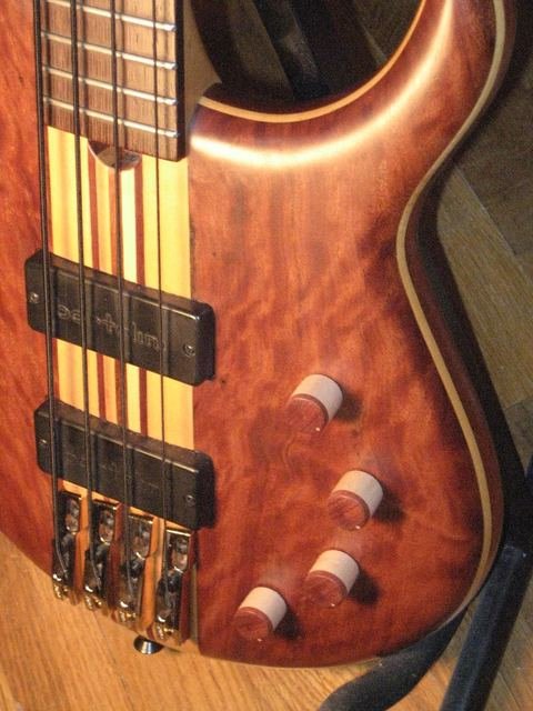 Four-string bass with a figured body and laminated neck