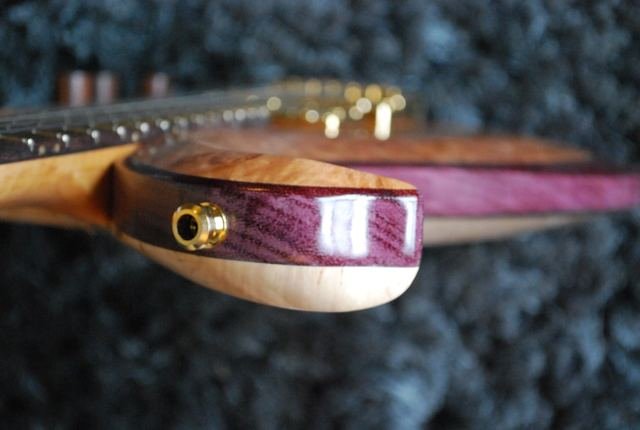 Body edge with purple binding and output jack